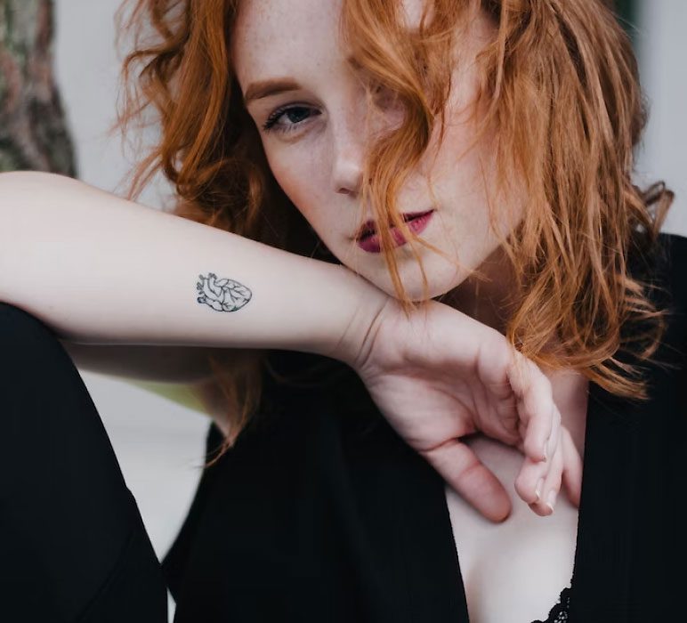 Woman with a Tattoo on her Arm